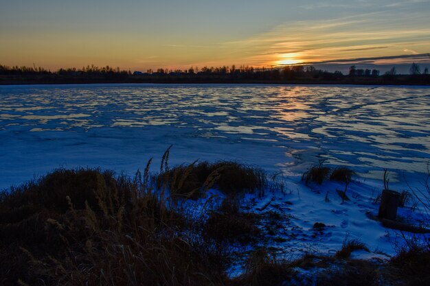 the first ice on the sun at sunset