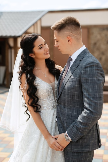 The first meeting of the bride and groom in the courtyard of the hotel