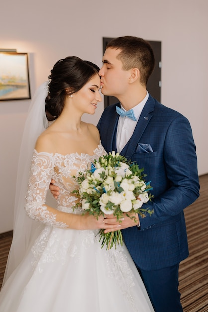 The first meeting of the bride and groom. First look of wedding couple in the morning.