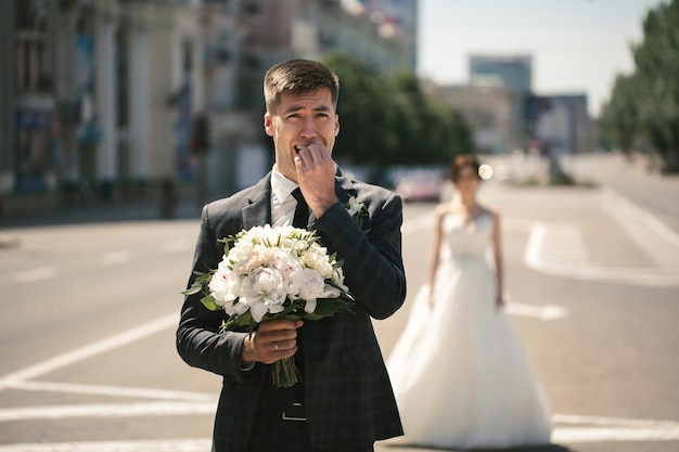 First meeting of the bride and groom on their wedding day on the road highway in the city