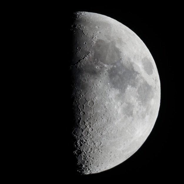 Photo first quarter moon seen with telescope