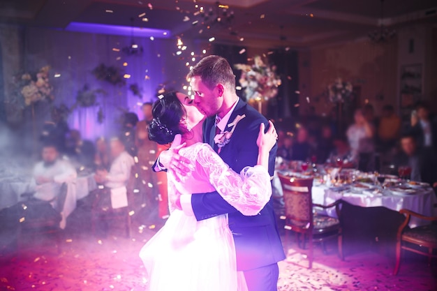 First wedding dance of newlywed Happy bride and groom and their first dance in elegant restaurant.