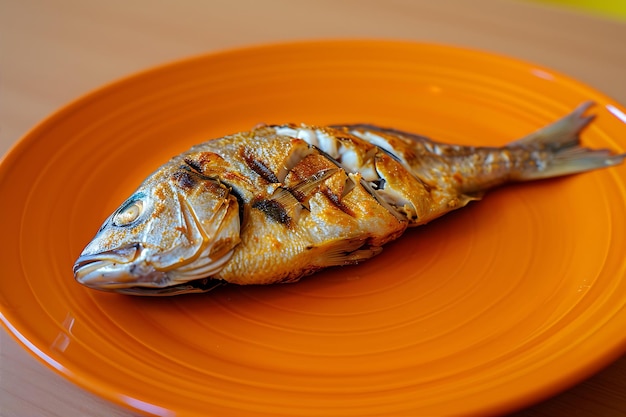 Photo fish appetizer cooked and served on orange