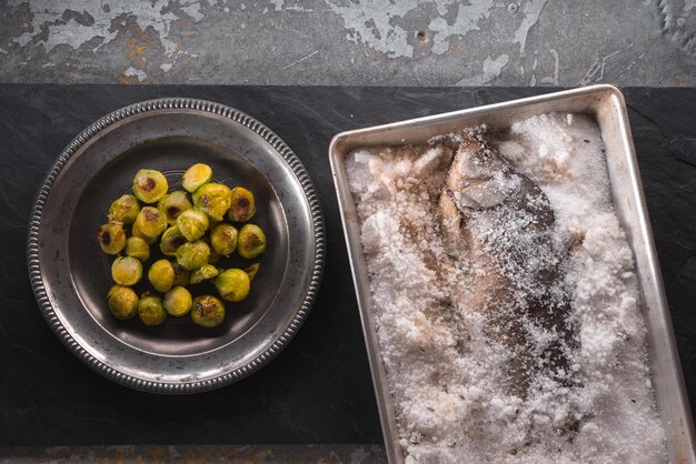 Fish baked in salt and brussels sprouts