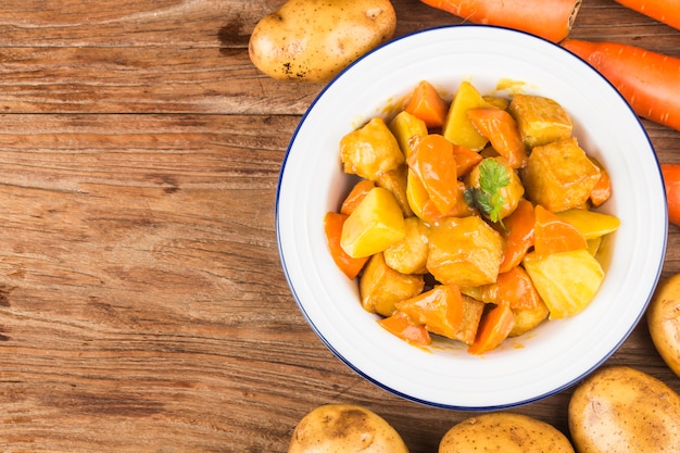 Fish balls with curry, potatoes and carrots