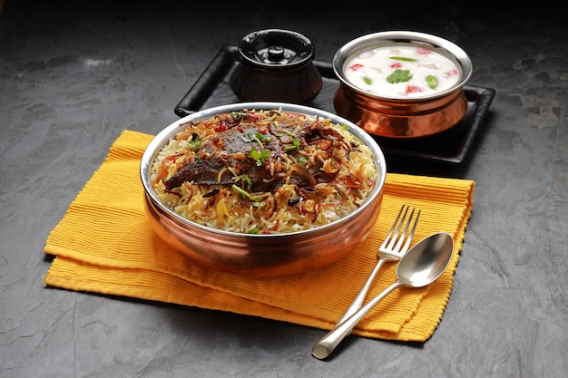 Fish Biriyani South Indian style fish biriyani arranged traditionally in a brass vessel