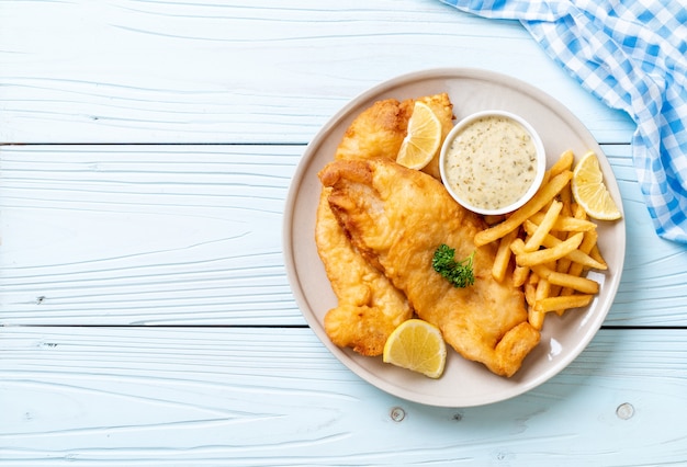 Photo fish and chips with french fries - unhealthy food