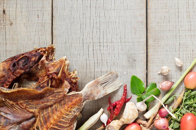 fish and curry on wooden.