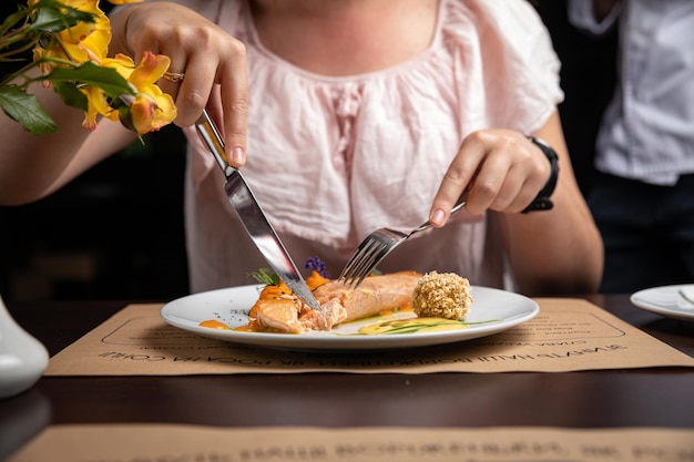 Fish dish with garnish on a plate in a restaurant