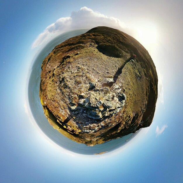 Fish-eye landscape against blue sky