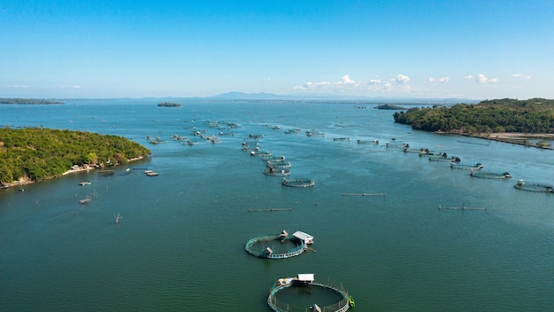 Photo fish farm with cages for fish and shrimp farming aquaculture or pisciculture practices philippines