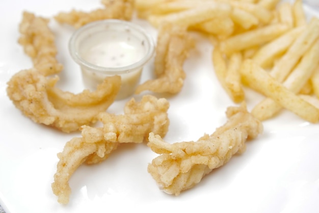 Fish fillet chips and potato mash on table