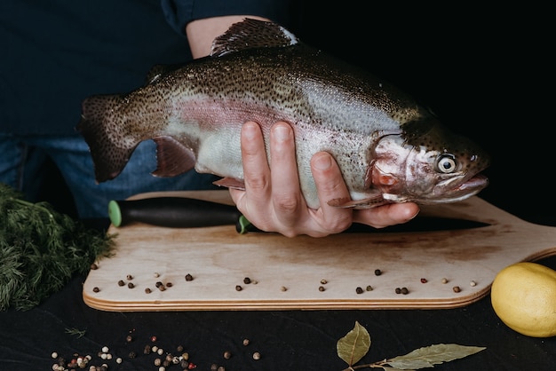 Fish in the hands of a chef