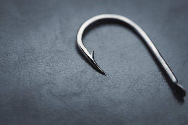 Fish hook on a black background closeup