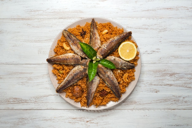 Fish Kabsa - mixed rice dishes that originates in Yemen. Middle eastern food.