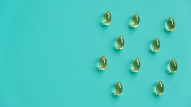 Fish oil capsules on a blue background. Omega-3