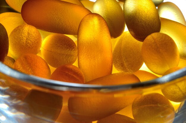 Photo fish oil capsules illuminated from below. close-up.