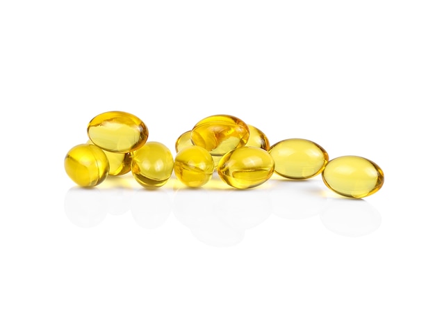 Photo fish oil capsules isolated on white background.