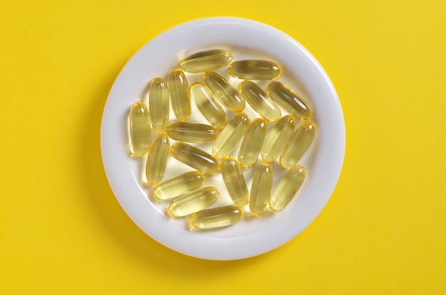 Fish oil capsules on a plate