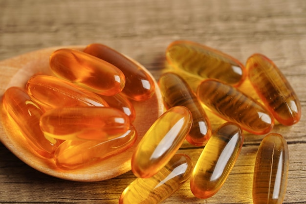 Fish oil or Cod liver oil gel in capsules with omega 3 vitamins supplementary healthy food