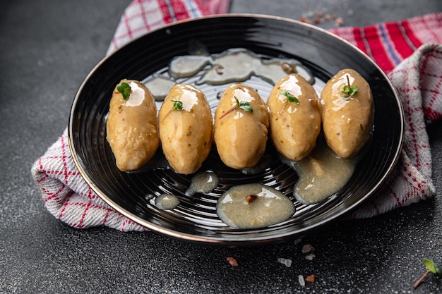 fish quenelles white sauce meal food snack on the table copy space food background rustic top view