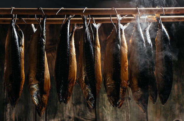 Fish Smoking Process For Home Use fish hanging side by side in a smoker Smoked Mackerel Smoking Process Fish In Smokehouse