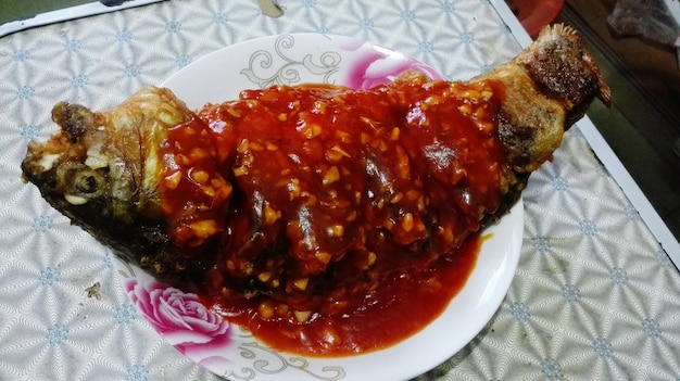 Fish with sauce on plate