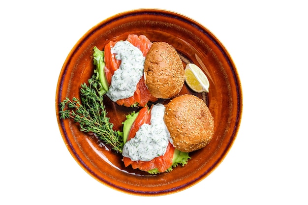 Fishburger with salted fish salmon avocado burger bun mustard sauce and Iceberg salad Isolated on white background