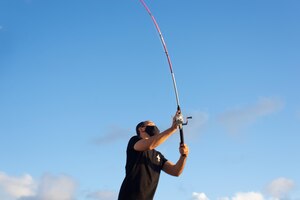 Fisherman in action with his pole in ponta do humaita