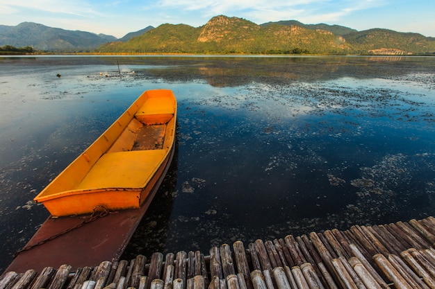 Fisherman boat floating in lake