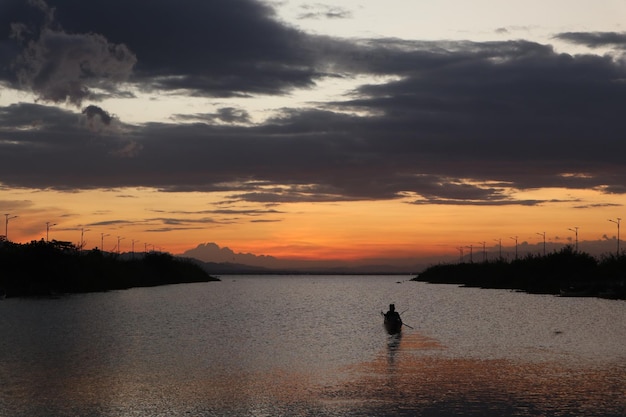 Fisherman on His Boat at Sunset. Fishermen Boat at Sunset