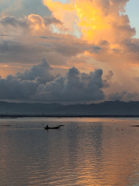 Fisherman on His Boat at Sunset. Fishermen Boat at Sunset