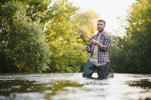 Fisherman hunting trouts in mountain river Fishing net detail