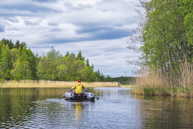 Fisherman on an inflatable boat on the lake