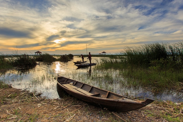 Fisherman in lotus lake at khao sam roi yot national park, Thailand