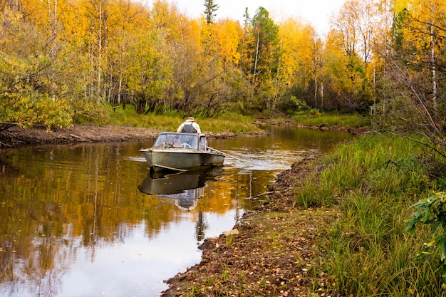 The fisherman rowing on a boat. Yamal.