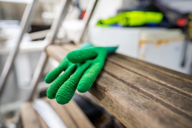 Fisherman wearing waterproof clothes and gloves on a fishing boat in australia in summer