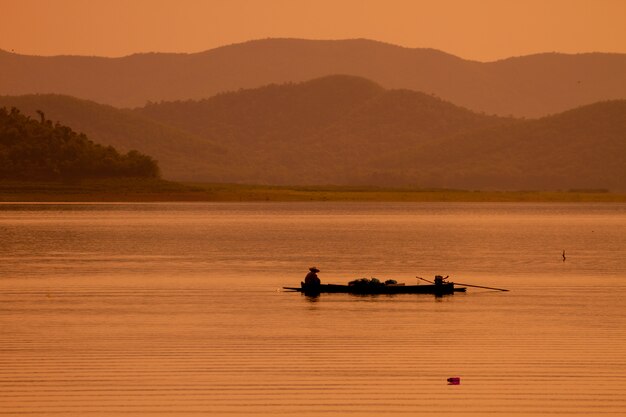 Fisherman with net at the lake