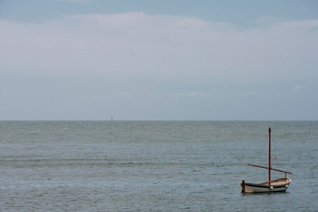 Fisherman wooden boat mooring at the harbor