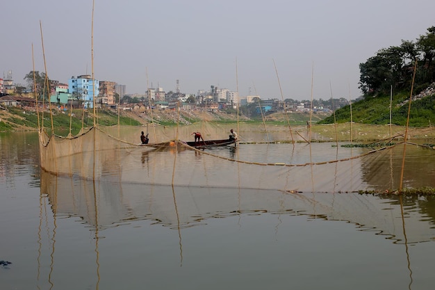 Fishermen are fishing in Sylhet Surma river