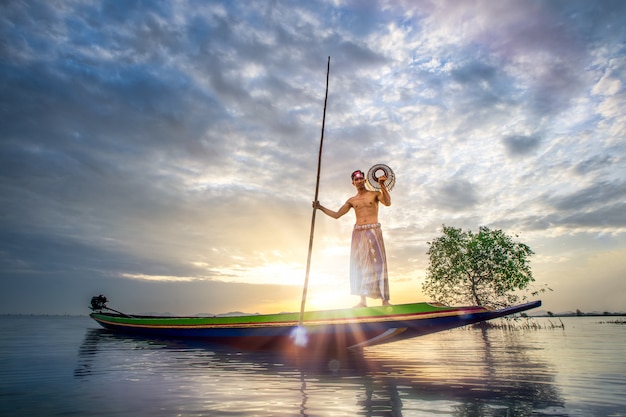 Fishermen are using fishing tools in the morning along the Songkhla Lake.