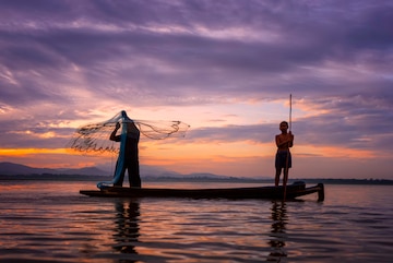 Premium Photo  Fishermen Casting are going out to fish early in the