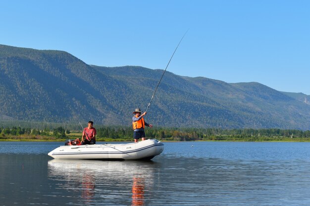 Fishermen catch fish in big lake