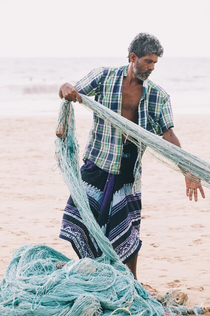 Fishermen collecting their catch fish on the beach