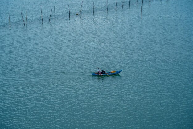 Fishermen working on wooden boat in Long Son Vung Tau