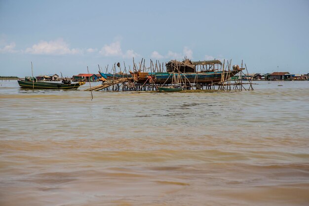 Fishermens dwellings on the water at Tonle Sap Lake in Cambodia Near their boats