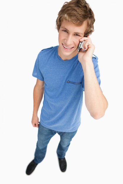 Fisheye view of a male student on the phone