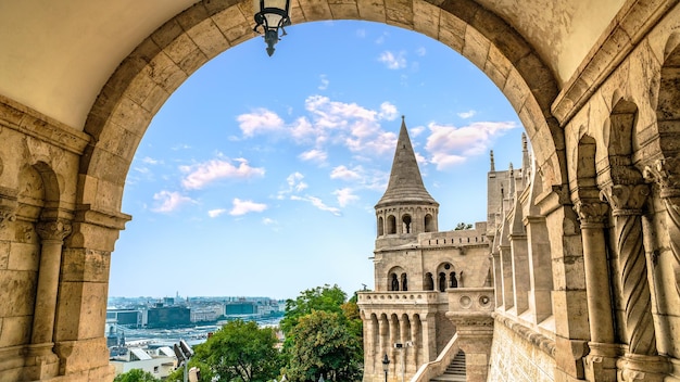 Fishing Bastion and Budapest at summer evening, view through arch