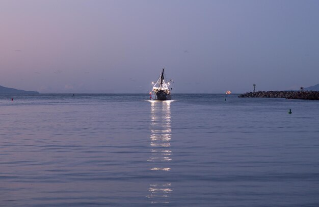 Fishing boat leaving Ventura harbor dawn