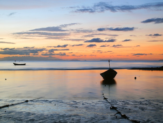 Fishing boat in the sea at sunrise       